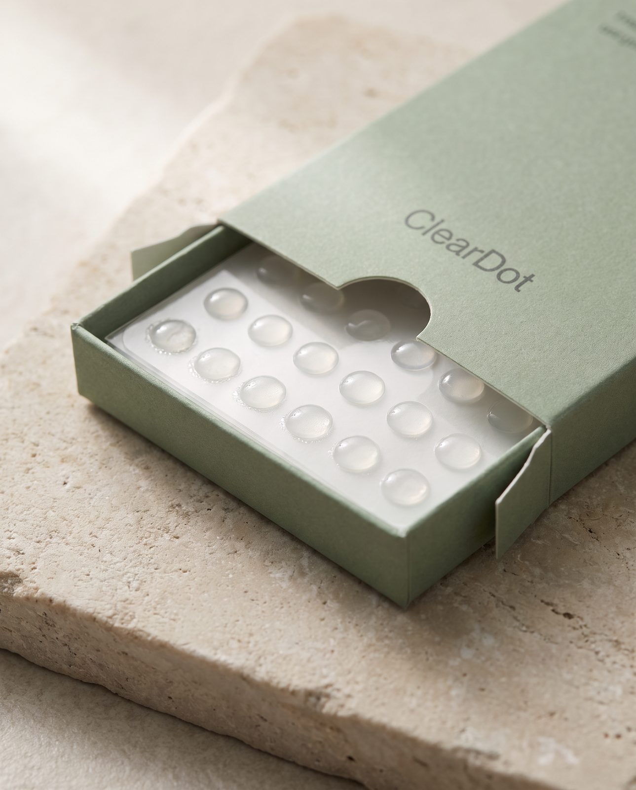 AI-generated after: ClearDot olive sleeve box on stone in soft light