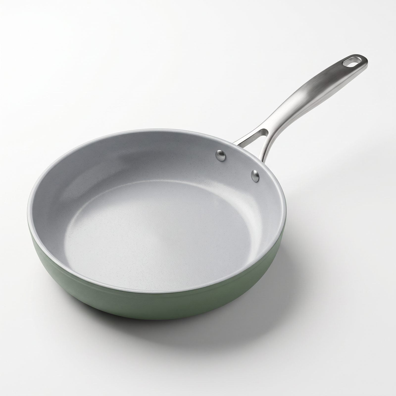 AI-generated sample still: sage Clayline ceramic frypan with stainless handle on white
